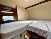 Carthago-Liner-For-Two-I-53-camper-letto-basculante-lato-sx.JPG