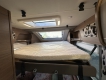 Knaus-Tourer-Van-500-LT-Vansation-camper-letto-basculante-sopra-dinette.jpg